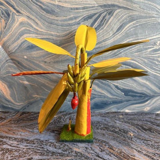 Handcrafted Navarathri Golu prop featuring a banana tree with clusters, a flower, and green leaves, set on a sturdy base.