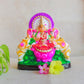 Hand-painted Navarathri Golu doll of Gajalakshmi seated on a lotus with elephants, adorned with vibrant colors and intricate details.