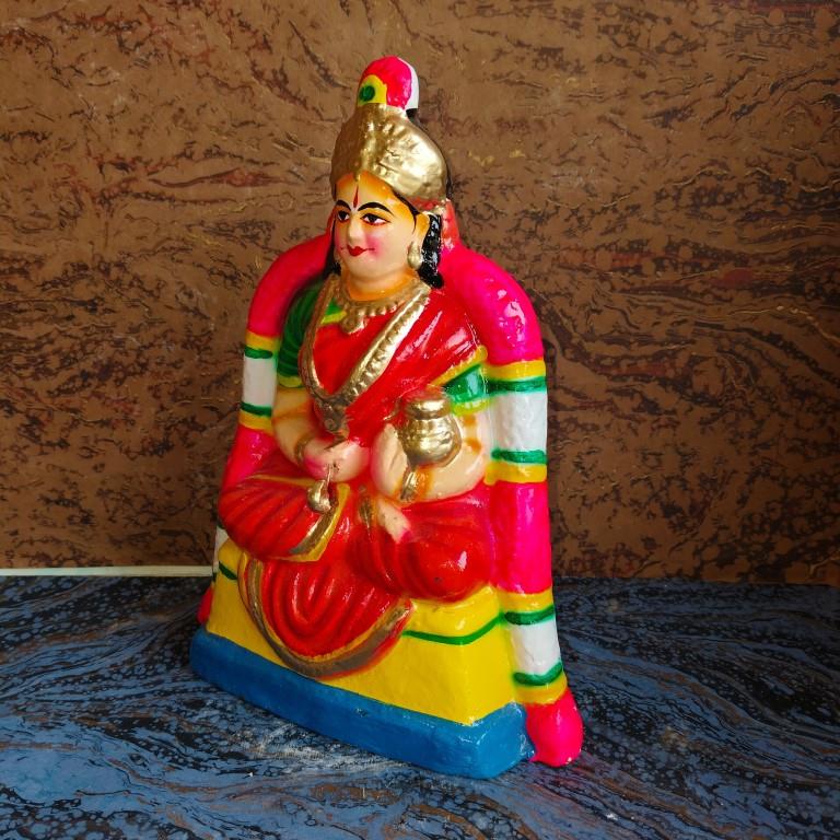 Handcrafted Goddess Annapoorani Navaratri Golu Doll with vibrant colors and intricate details, symbolizing prosperity and nourishment.