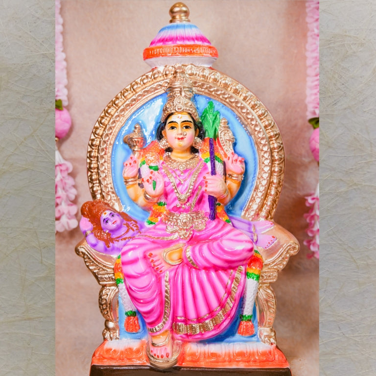 Handcrafted Navarathri Golu doll of Goddess Lalithambigai seated on a decorative throne, adorned in vibrant pink and gold accents.