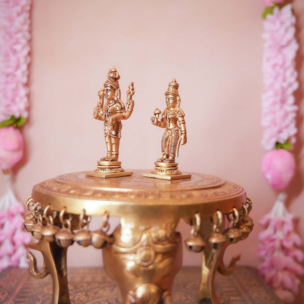 Handcrafted Brass Shiva Parvathi Set featuring intricately detailed figurines of Lord Shiva and Goddess Parvathi, ideal for home temples and Navaratri decor.