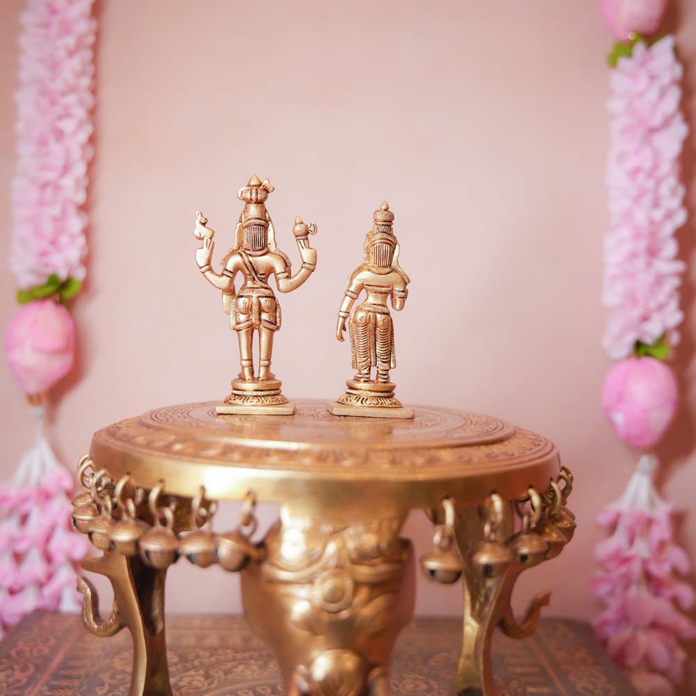 Handcrafted Brass Shiva Parvathi Set featuring intricately detailed figurines of Lord Shiva and Goddess Parvathi, ideal for home temples and Navaratri decor.