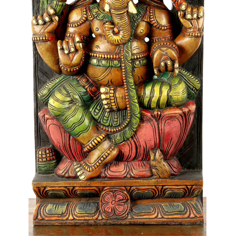 Lotus-Seated Ganesha Enshrining Prabhavali – Handcrafted Wooden Statue With Vibrant Detailing