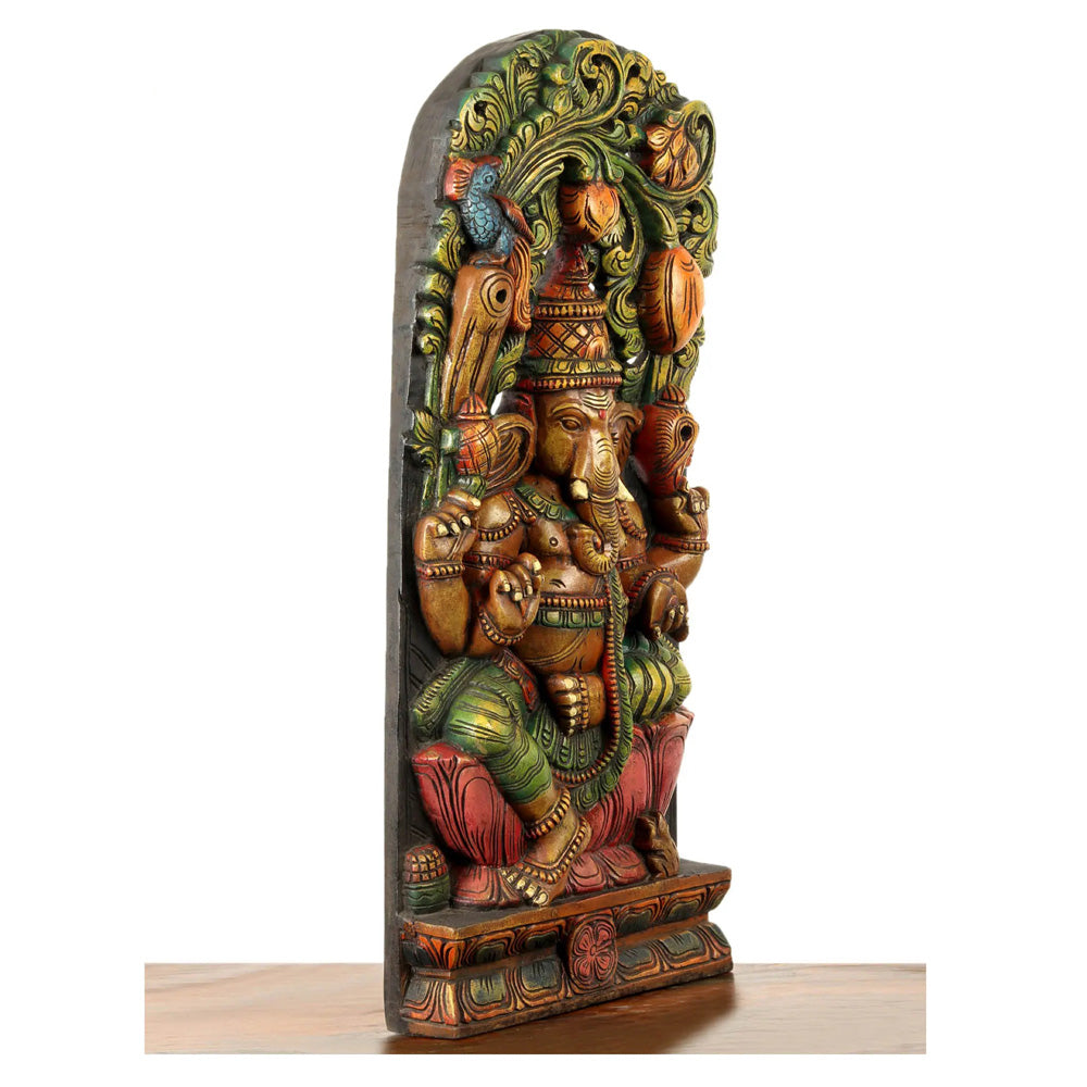 Lotus-Seated Ganesha Enshrining Prabhavali – Handcrafted Wooden Statue With Vibrant Detailing