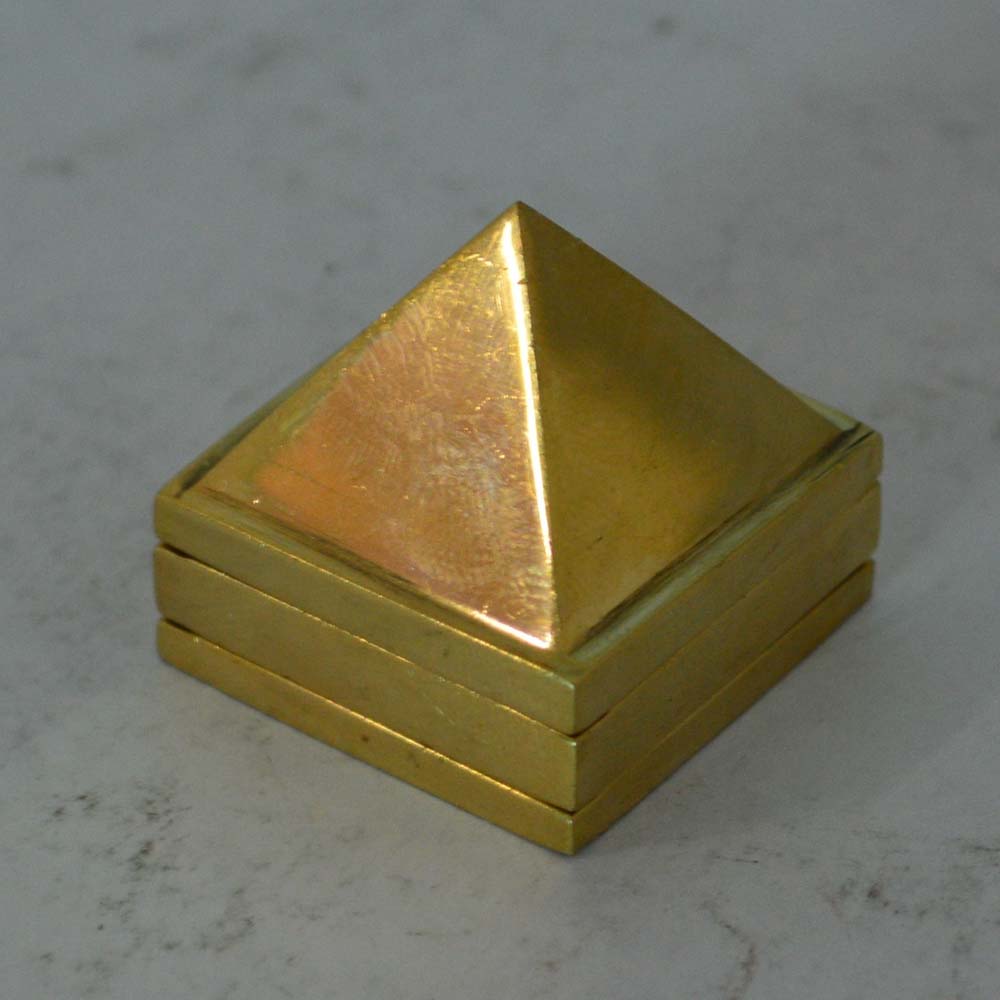 Eternal brass pyramid designed for Vastu energy balancing, ideal for enhancing positivity and harmony in homes and offices.