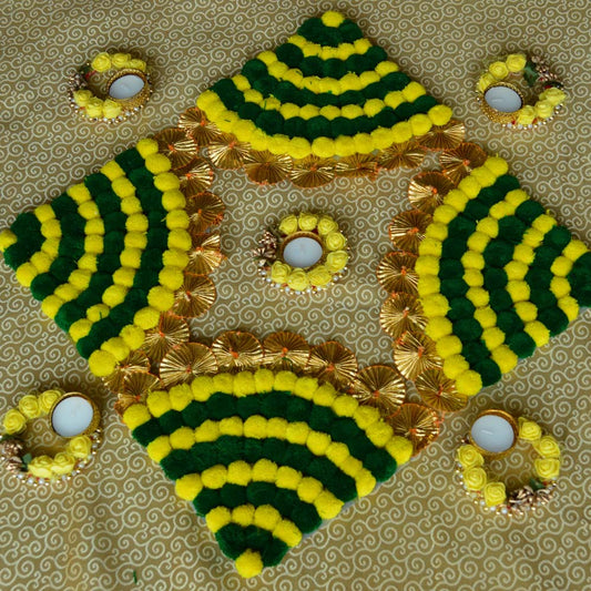 Auspicious Pom Pom Floor Decoration Set with green and yellow pom-poms, golden accents, and floral T-light holders for festive decor.