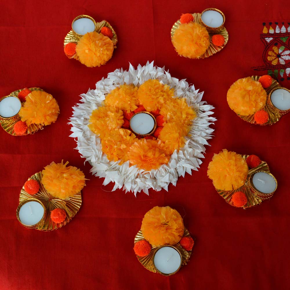 Fancy Marigold and White Floral Floor Decoration Set with T-light holders on a red background.