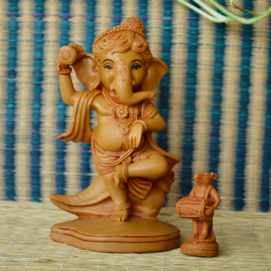 Handcrafted Chandan Dancing Ganesha Statue with Mooshika, intricately detailed in a natural wood finish.