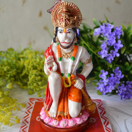 Handcrafted Blessing Hanuman Idol with marble finish, kneeling posture, and vibrant hand-painted details.