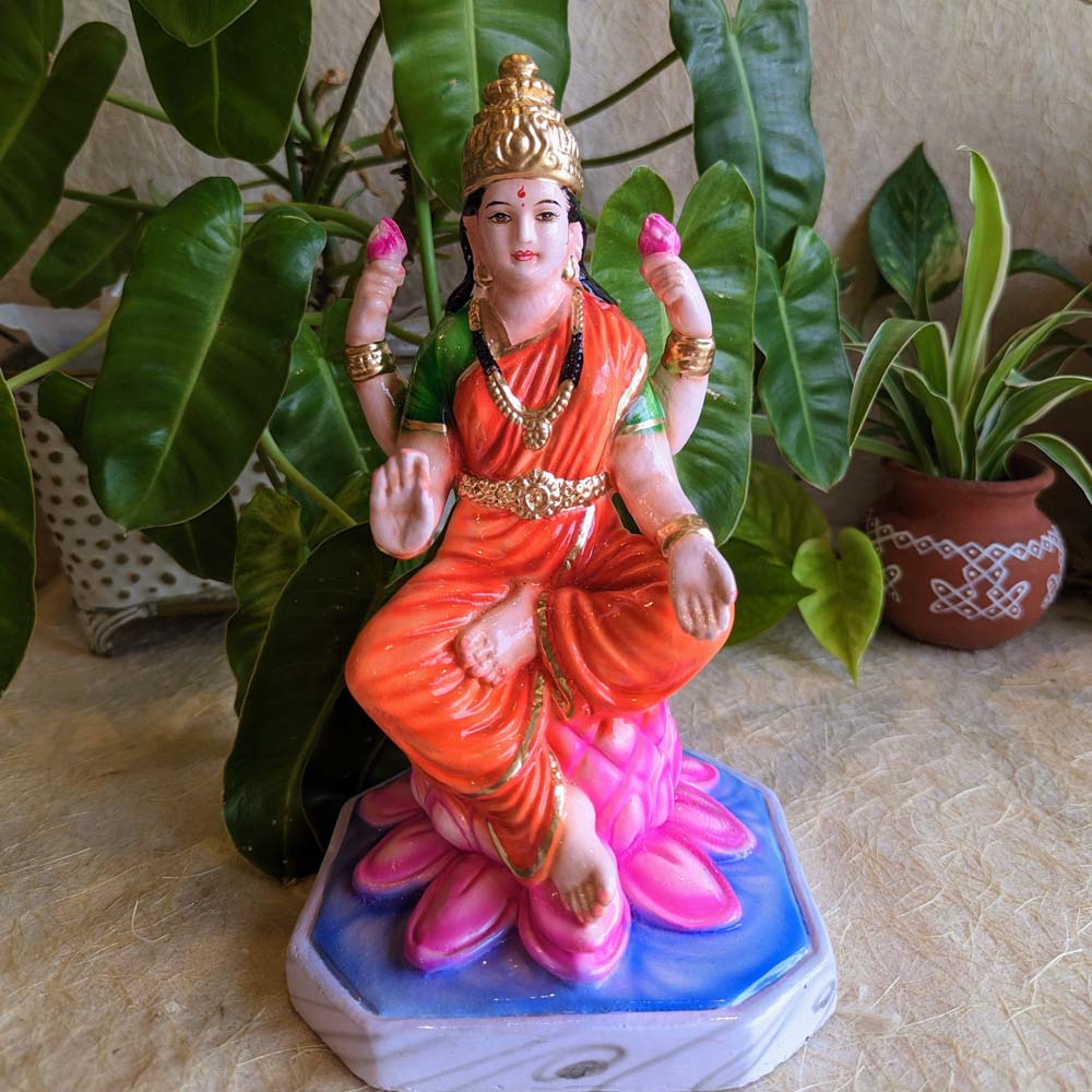 Handcrafted Saraswati Golu Doll depicting the goddess seated on a lotus, intricately painted and ideal for Navaratri celebrations.