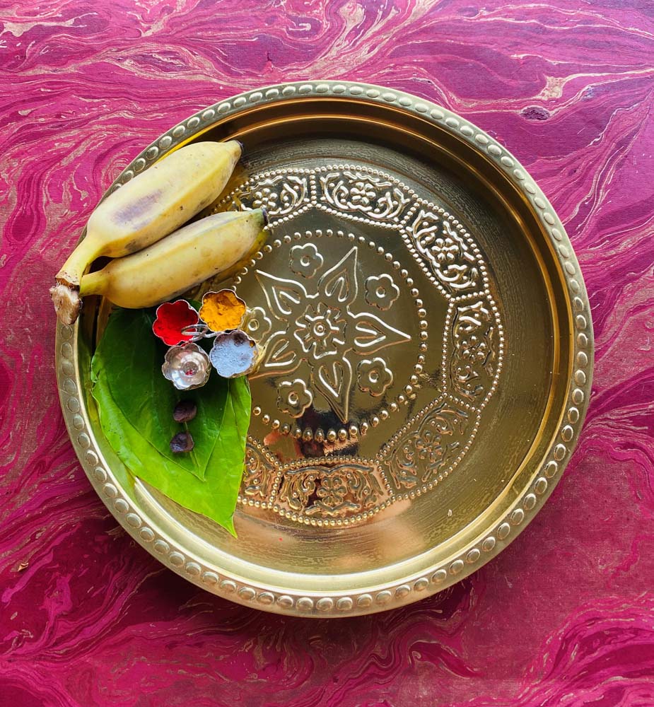 Eternal Round Flower Puja Plate 13 in brass with embossed flower design.