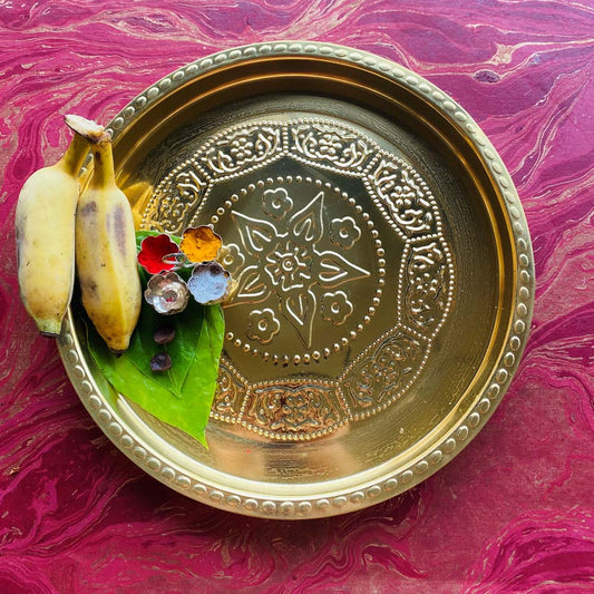 Eternal Round Flower Puja Plate 11 in brass with embossed flower design.