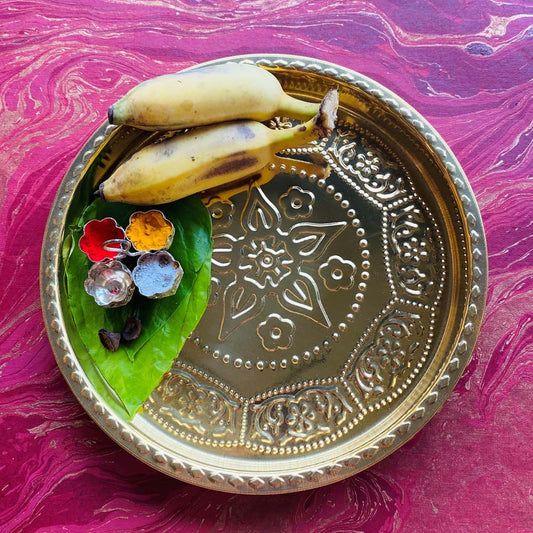 Eternal Round Flower Puja Plate 10 in brass with embossed flower design.