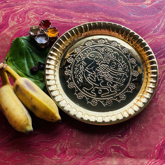 Eternal Plate Annam 10 in brass with peacock embossed design.