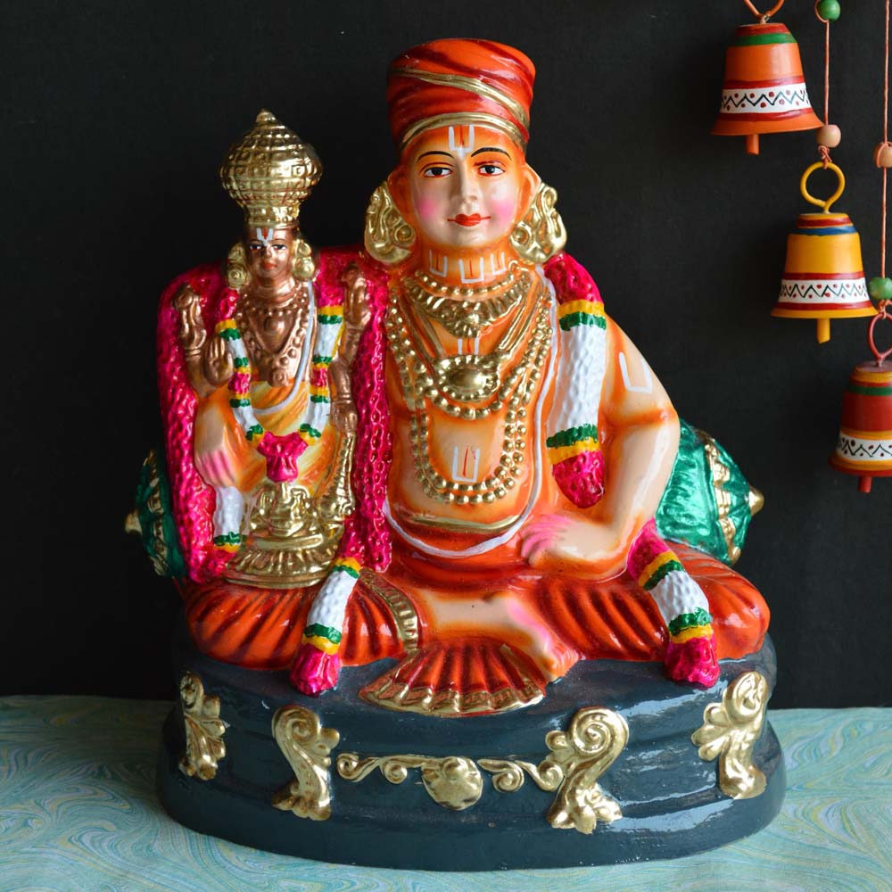 Handcrafted Navarathri Golu doll of Saint Ramanujar with Chella Pillai, detailed with vibrant colors.