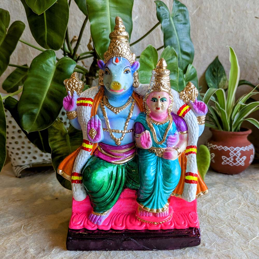 Navarathri Golu Dolls featuring Lord Varaha and Goddess Lakshmi, seated together and hand-painted in vibrant hues.