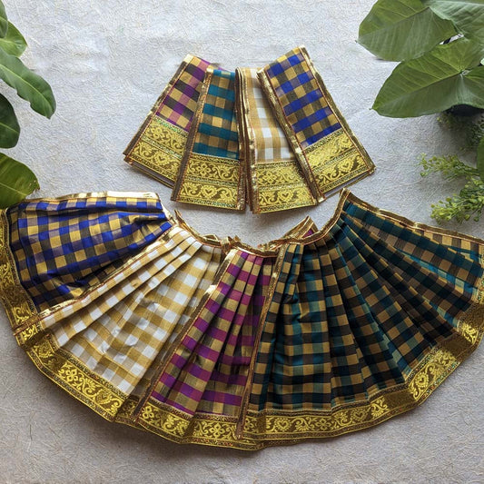 A collection of colorful checked Devi skirts with golden borders, designed for adorning deity idols and ceremonial decorations.