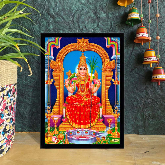 Kanchi Kamakshi Amman artwork featuring the Goddess seated on a lotus within an ornate golden arch, adorned with vibrant silk attire and sacred items.