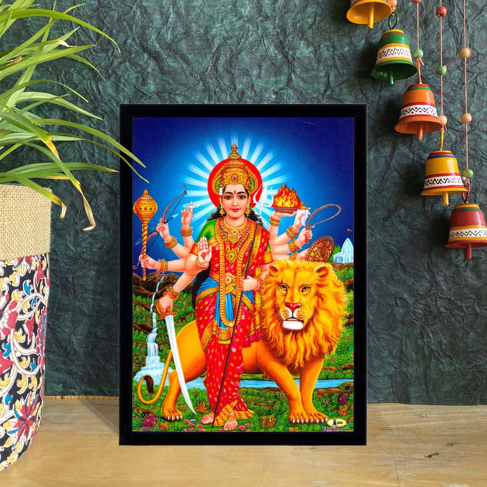 Goddess Durga standing with a lion, holding weapons in her multiple arms, against a vibrant background – spiritual wall décor.