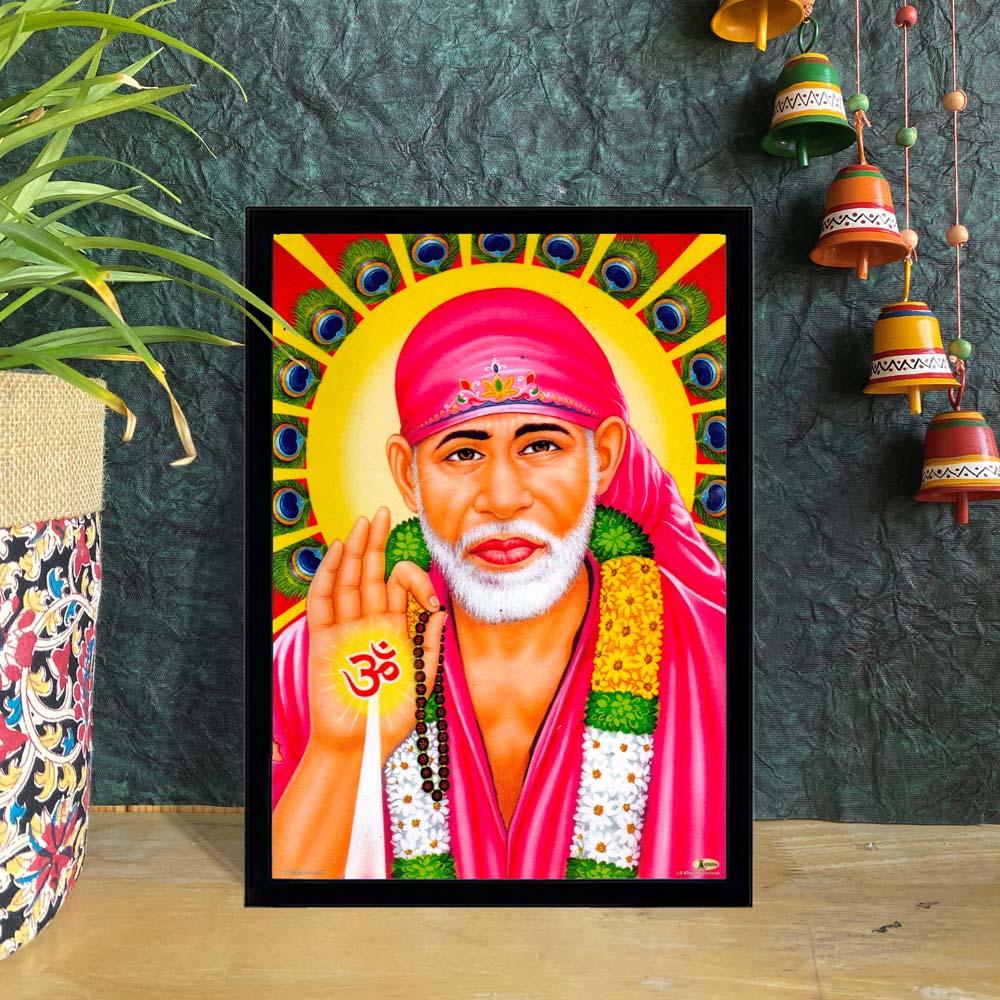 Sai Baba blessing wall art with a garland, peacock feather background, and halo in vibrant colors, framed for spiritual decor.