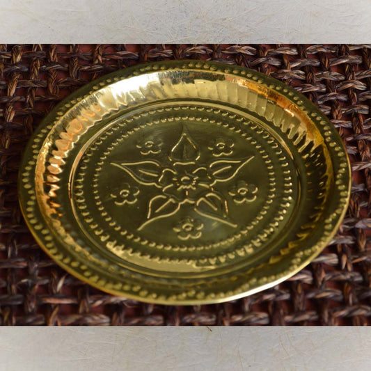 Eternal Flower Puja Plate in brass with embossed flower design.