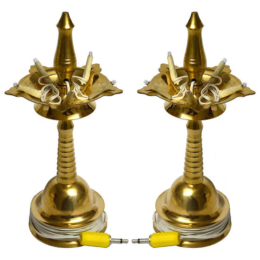 Set of traditional brass electrical lamps with classic South Indian design and electrical fittings.