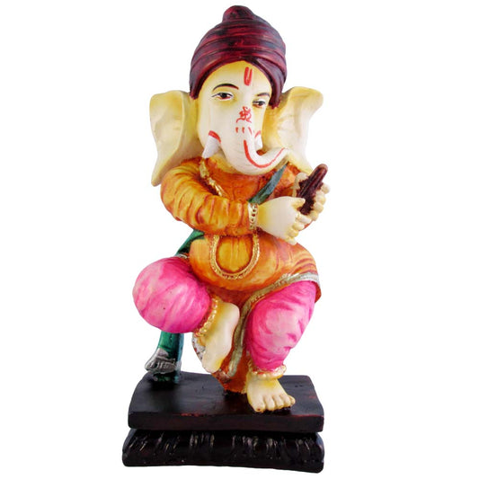 Handcrafted vibrant Ganesh idol seated with a musical instrument, symbolizing creativity and positivity.