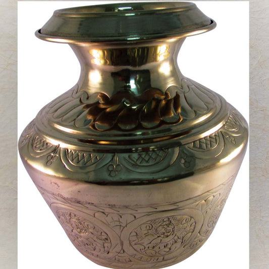 Eternal Astalakshmi Kudam with intricate brass carvings and polished finish.