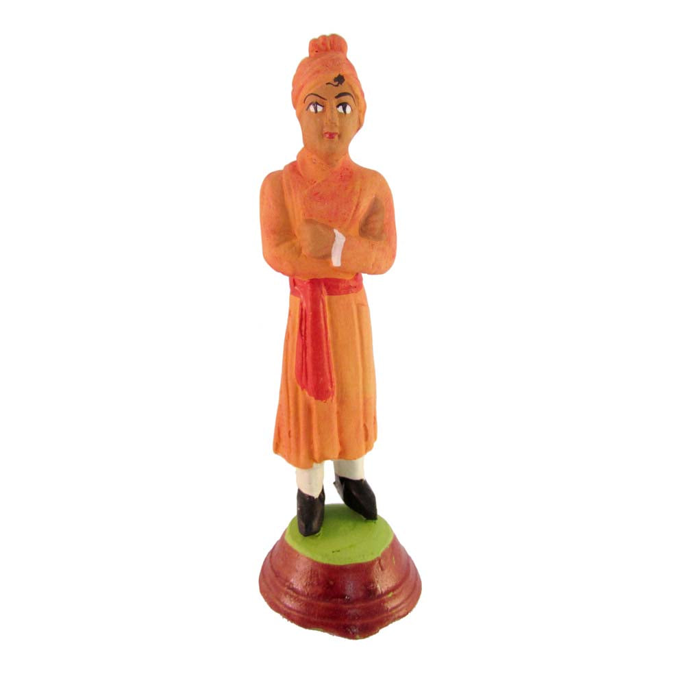 Handcrafted Golu doll of Swami Vivekananda in orange attire, representing wisdom and spirituality.