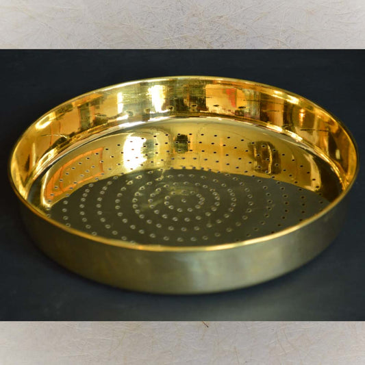 Eternal Abhishekam Jali Plate in brass with spiral perforated design.