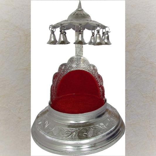 Silvery Simhasan with round base, bells, and red velvet interior.